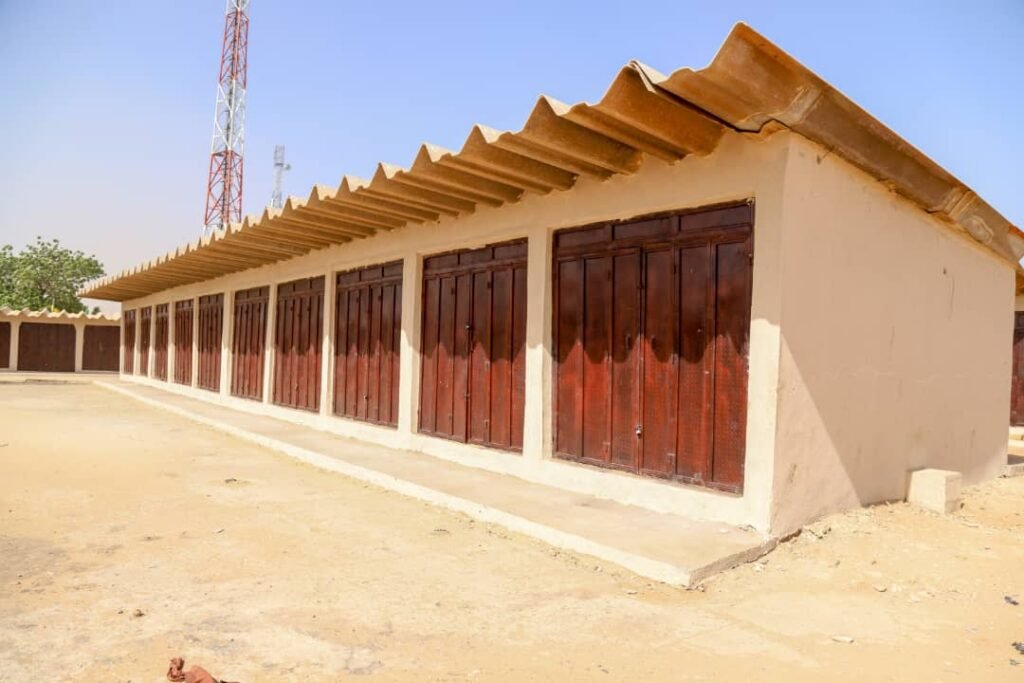 Bagudu distributes new shops to traders, promises to sustain economic activities