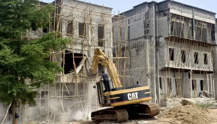 FCTA demolishes 11 buildings under high tension in Apo-Dutse