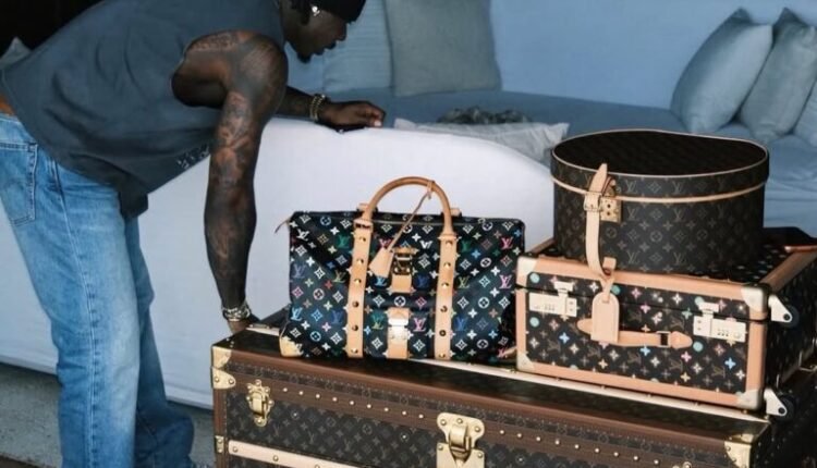Fans react as Asake flaunts Louis Vuitton trunk worth over N90m